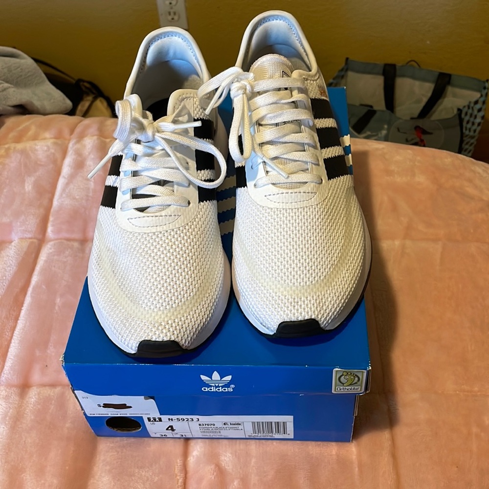 Adidas white running shoes . Size 4 only worn once